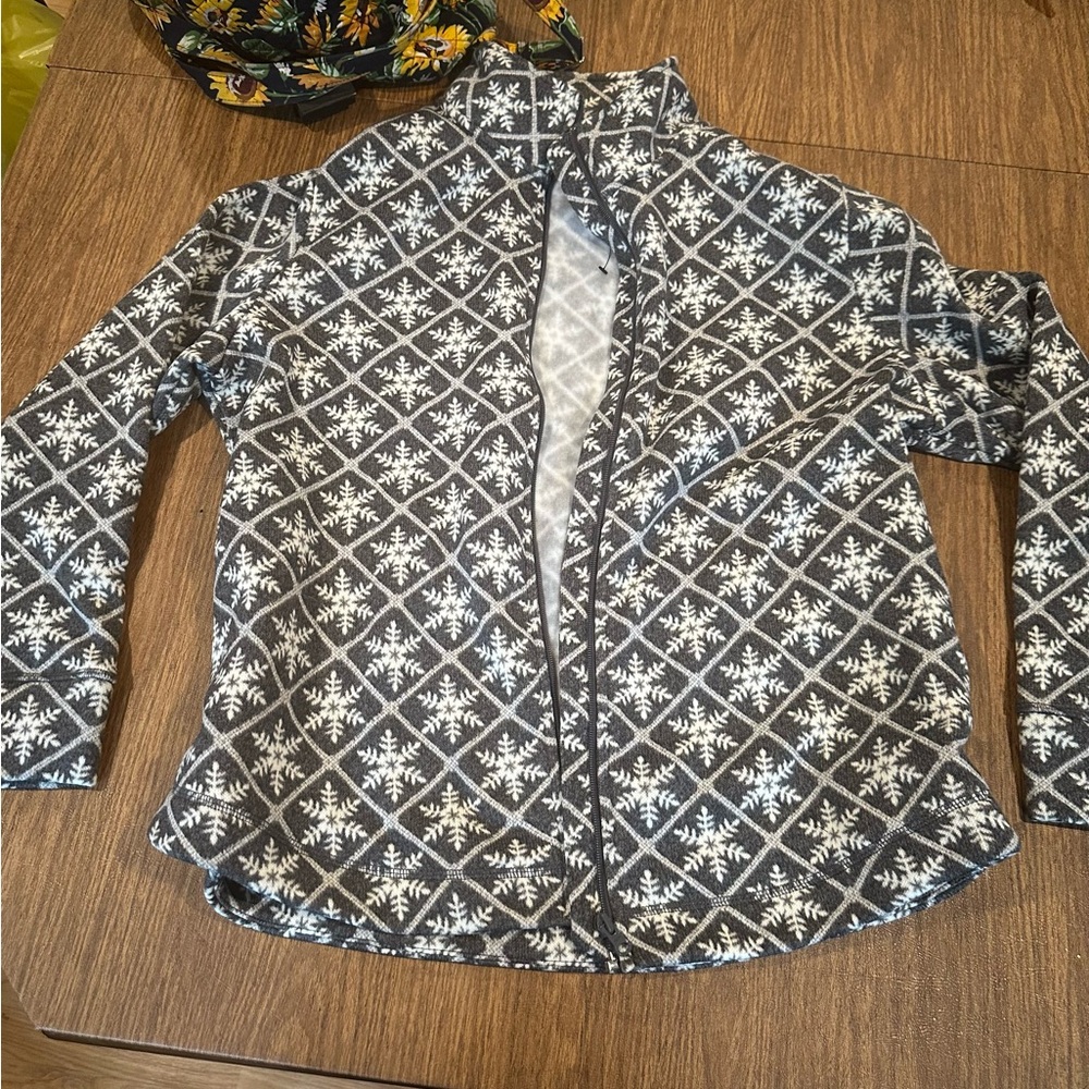 A sweater with a zipper. Brand new from Talbots, it’s a xl. With snowflakes